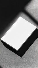 A sleek mockup of a blank DVD cover lies flat, highlighting its clean design on a dark surface