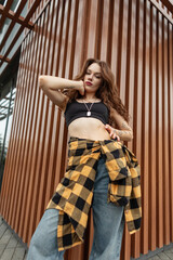 beautiful young woman in fashionable clothes with top, Plaid Twill Western Shirt and blue vintage...