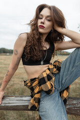 Beautiful natural fresh fashion rural girl in fashionable outfit with black top with shirt and...