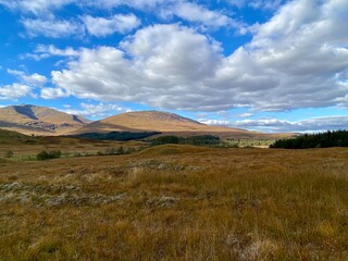 distant mountains in highlands with blue sky