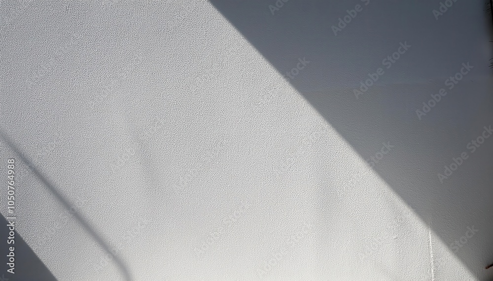 Poster minimalist textured white wall with diagonal sunlight and shadows. perfect for backgrounds, web bann