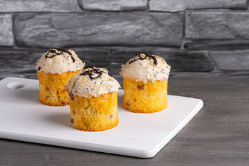 Three creamy holiday Easter cupcakes with white icing