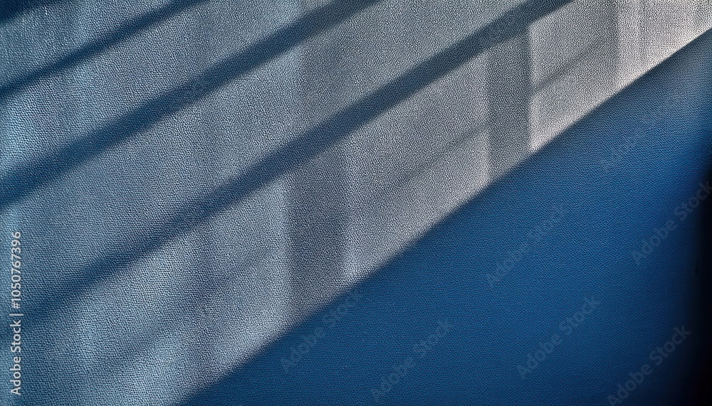 Poster abstract textured blue wall with diagonal shadows from sunlight through window, minimalist backgroun