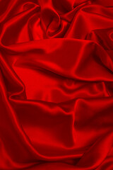 Fototapeta premium Rich and luxury red silk fabric texture background.