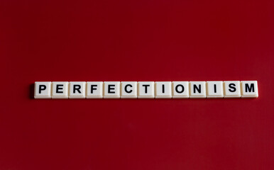 Perfectionism word in letter beads