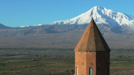 Drone footage of the dome of Khor Virap monastery on a sunny day in the Ararat Plain in Armenia