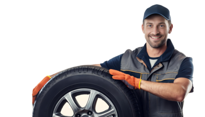 Smiling mechanic holding a car tire on transparent background