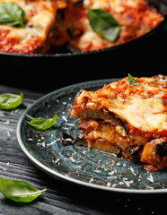 Traditional homemade Aubergine parmigiana with tomato sauce parmesan and mozzarella cheese