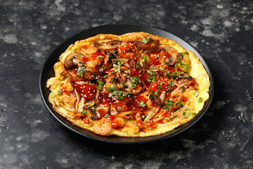 Foo Young Chinese egg omelette filled with vegetables, mushrooms, shrimp and sauce