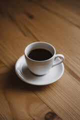 cup of coffee on wood table