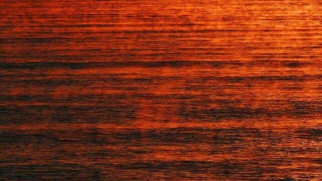 Sunlight sparkles over ocean waves. Sunrise texture. Mist over the water.
