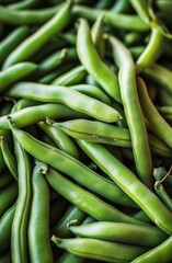 Fototapeta premium Freshly harvested green beans on a dark surface, perfect for cooking and healthy meals