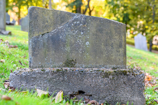 Very old broken grave marker closeup.