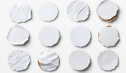 This image features a collection of twelve paper textures, each uniquely shaped and displaying a variety of creases, folds, and smooth surfaces, creating visual interest.