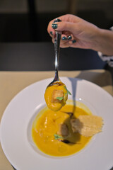 Rich Pumpkin Soup Spoonful with Crouton Garnish