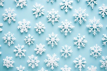 White snowflakes intricately scattered across a vibrant blue background, evoking a wintery atmosphere.