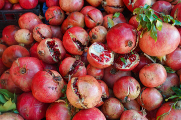 Pile of fresh ripe pomegranates at a market