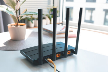 Black wifi router with four antennas