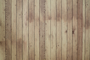 Fototapeta premium Wooden fence made of wooden planks shows off a gorgeous wooden texture background