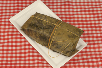 Tamal Typical Colombian Food Wrapped in Banana Leaves