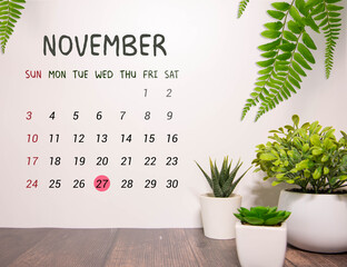 November calendar background with number 27. Stationery pens