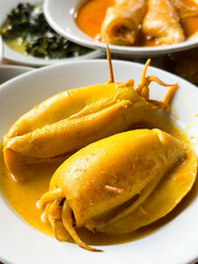 Stuffed squid with gravy