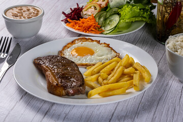 grilled meat with potatoes and vegetables
