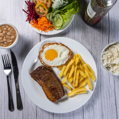 grilled meat with potatoes and vegetables