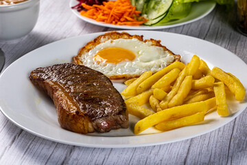 grilled meat with potatoes and vegetables