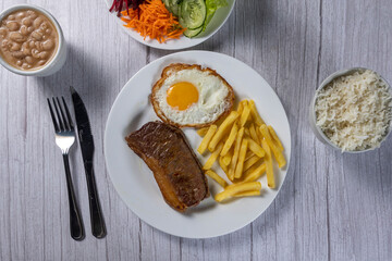 grilled meat with potatoes and vegetables