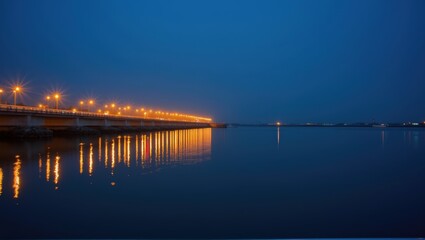 Obraz premium A nighttime bridge over calm water with reflections, creating a serene and tranquil atmosphere. Generative, AI,