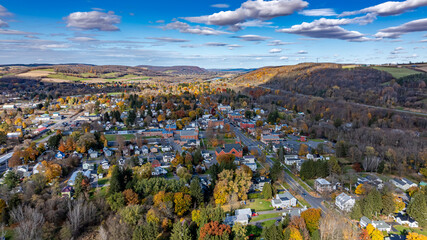 Aerial photo of fall foliage surrounding the Village of Homer, Cortland County, New York State, October 2024. 