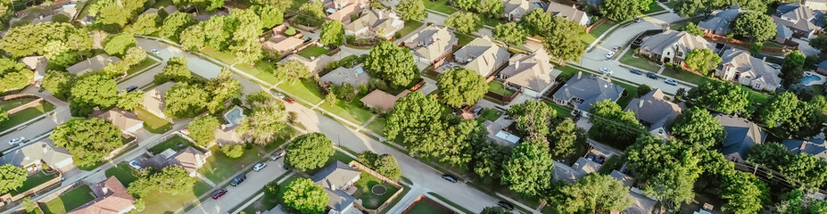 Panorama aerial view residential street in lush greenery neighborhood in Coppell Texas Dallas Fort Worth metroplex, row of detached single-family houses swimming pool, large backyard, grassy lawn