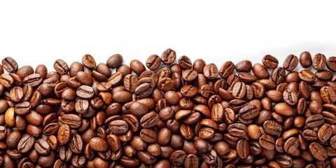 Fototapeta premium A close-up photograph of a large group of coffee beans scattered on a white surface, creating a horizontal border at the bottom of the image.