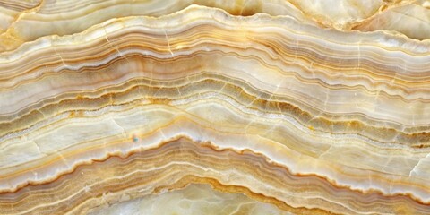 Fototapeta premium A Natural Stone Background with Intricate Bands of Creamy and Golden Hues