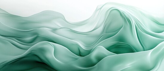 Obraz premium Abstract green fabric with soft folds and waves, creating a dynamic and elegant background.