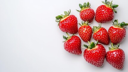Obraz premium Bright strawberries against a white background, a burst of summer sweetness, perfect for fresh food promotions