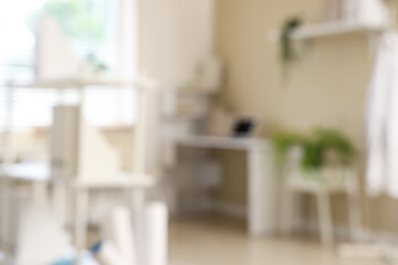 Light interior of doctor's office in clinic, blurred view
