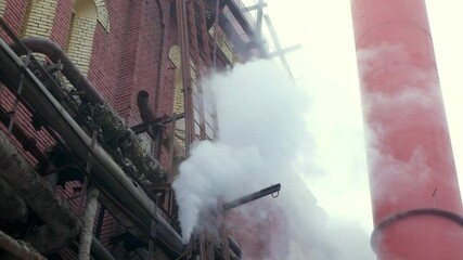 Smoke from a chimney in an industrial area of the 20th century. color nature