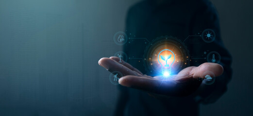 A hand holding a glowing sphere representing technology and innovation, surrounded by digital...