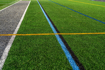 Fototapeta premium Image of a sideline on a multi-use synthetic turf field with multiple sports. 