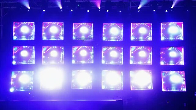 A vibrant LED wall light animation featuring flashing bulbs 19 different screens perfectly synchronized stage lights immersive 4K video presentation performance settings abstract background blinking