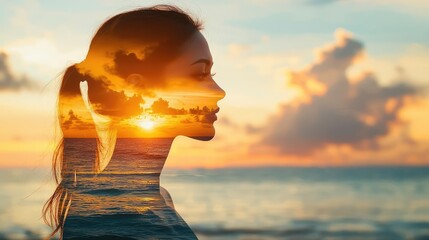A woman's profile blended with a sunset over the ocean, evoking calmness.