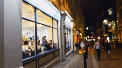 Experience the vibrant nightlife at a cozy restaurant filled with enthusiastic patrons enjoying their meals