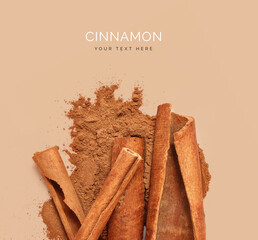 Creative layout made of cinnamon sticks and powder. Food concept. Macro concept.