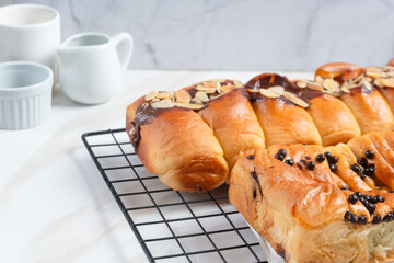 croissant with chocolate filling and almonds on top. perfect for recipe, article, catalogue, or any commercial purposes. with copy space.