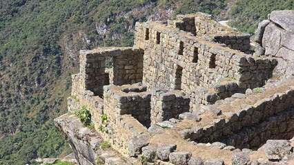 Close up of a house and building at the archaeological site of Machu Picchu in Peru