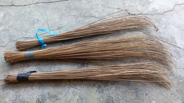 Sapu lidi or broom stick. Cleaning tool for sweeping. Traditional equipment. Placed on the floor.