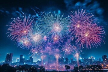 Obraz premium Fireworks Display Over a City Skyline at Night