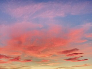 Fototapeta premium Golden and pink sky with clouds at sunset 